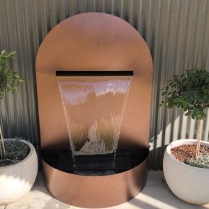 “ANAHITA (Arched)" Stainless steel water feature with “Antique Copper” powder-coated frame